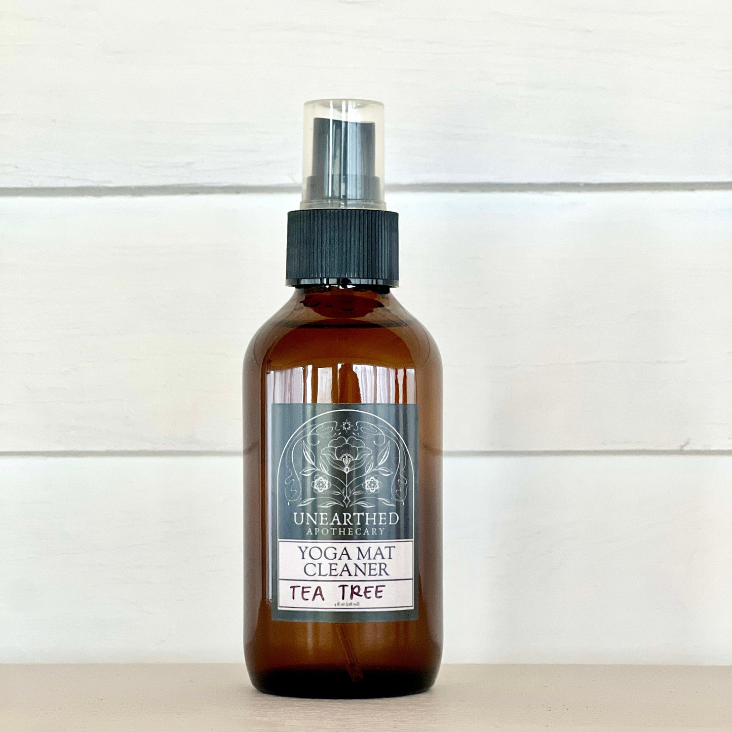 Tea Tree Yoga Mat Cleaning Spray by Unearthed Naturals, featuring natural tea tree oil for an antibacterial and refreshing clean.